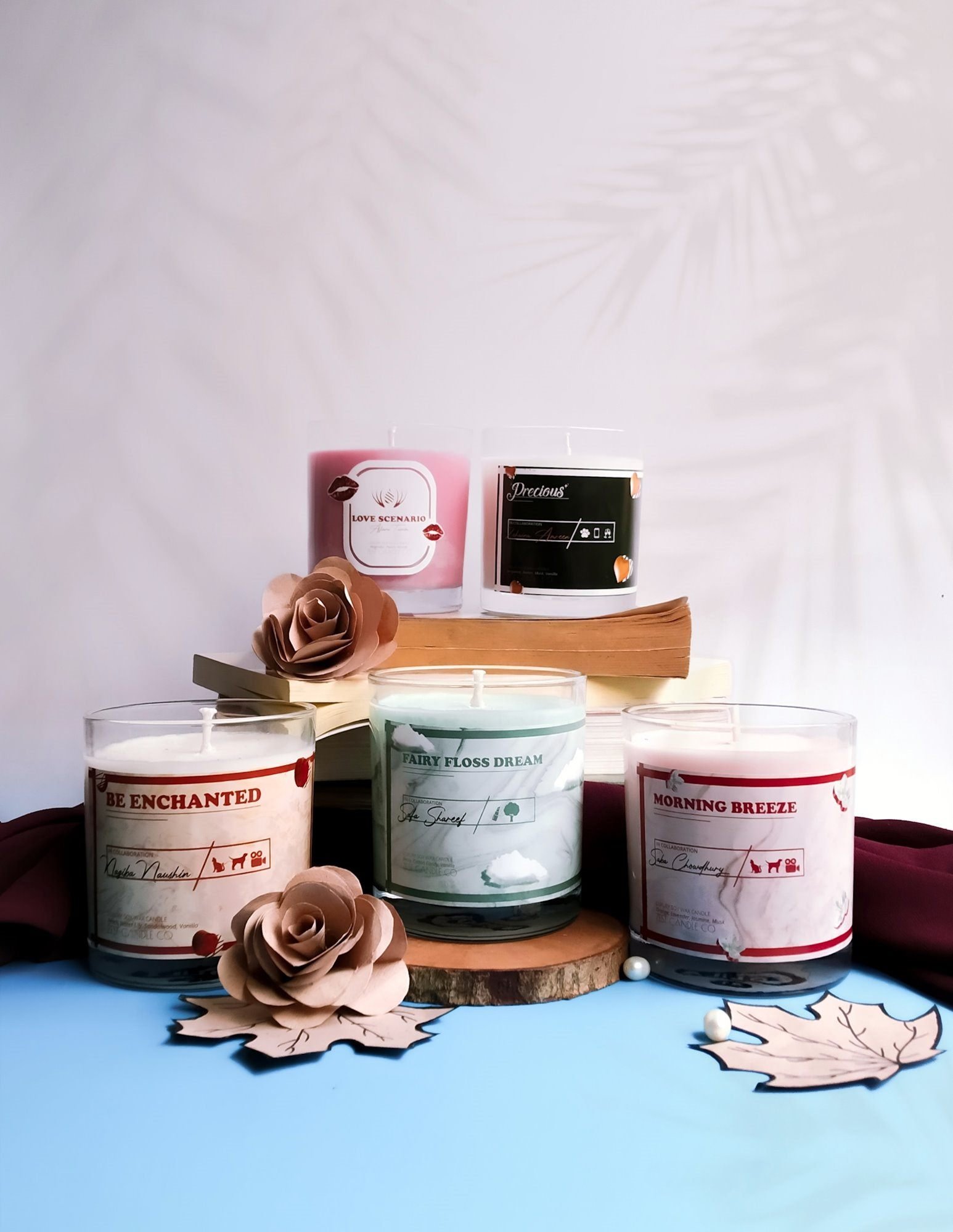 The range together: Love Scenario, Precious, Be Enchanted, Fairy Floss Dream and Morning Breeze, styled with books, paper roses and pearls.